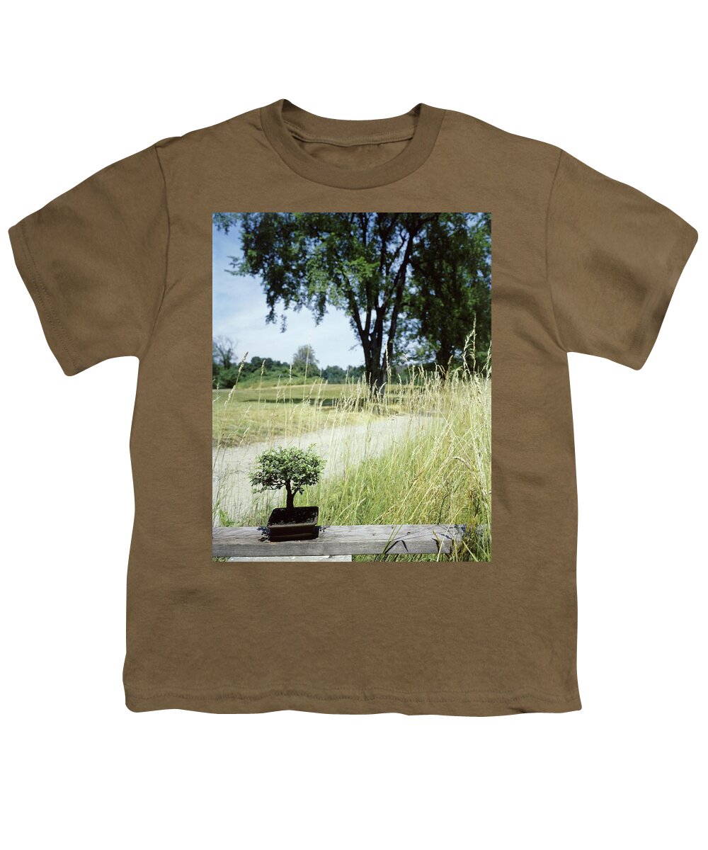 Plants Youth T-Shirt featuring the photograph A Bonsai Tree In A Hayfield by Pedro E. Guerrero