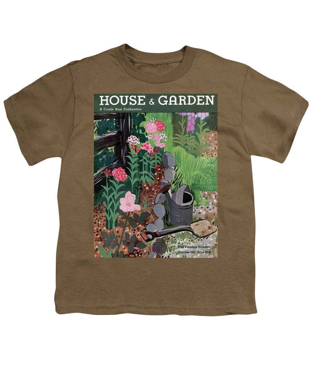 House And Garden Youth T-Shirt featuring the photograph A Watering Can And A Shovel By A Flower Bed by Witold Gordon