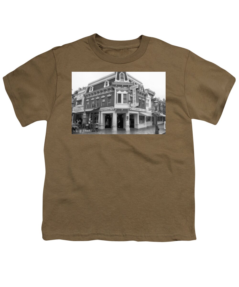 Main Street Youth T-Shirt featuring the photograph Carnation Cafe Main Street Disneyland BW by Thomas Woolworth