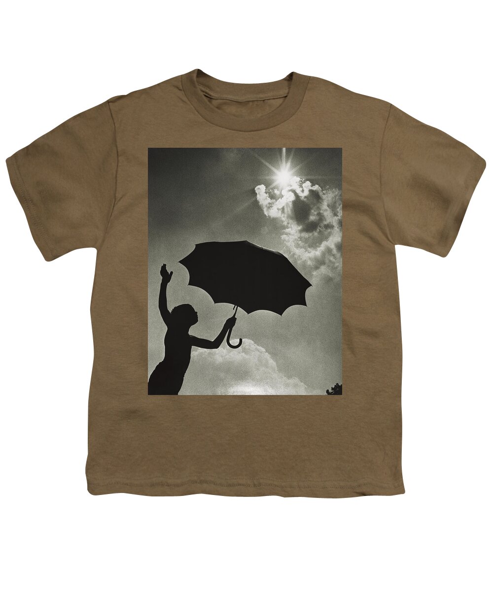 1960s Youth T-Shirt featuring the photograph Silhouetted Boy With Umbrella, C.1960s by H. Armstrong Roberts/ClassicStock