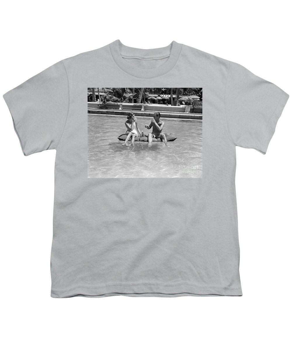 1930s Youth T-Shirt featuring the photograph Couple Relaxing In Pool, C.1930-40s by H Armstrong Roberts and ClassicStock