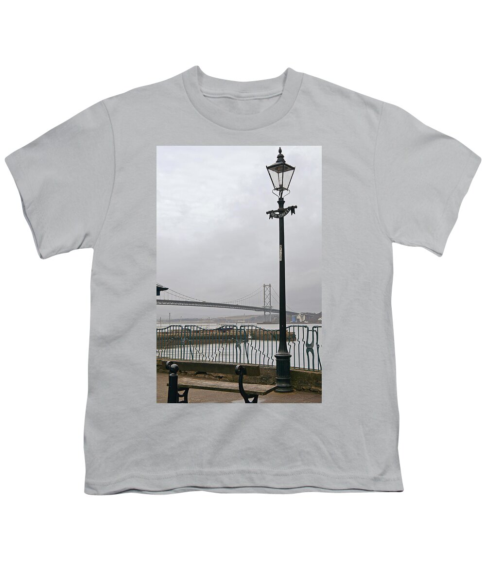 Bridge Youth T-Shirt featuring the photograph Lamppost on High Street with view to the Forth road bridge. by Elena Perelman