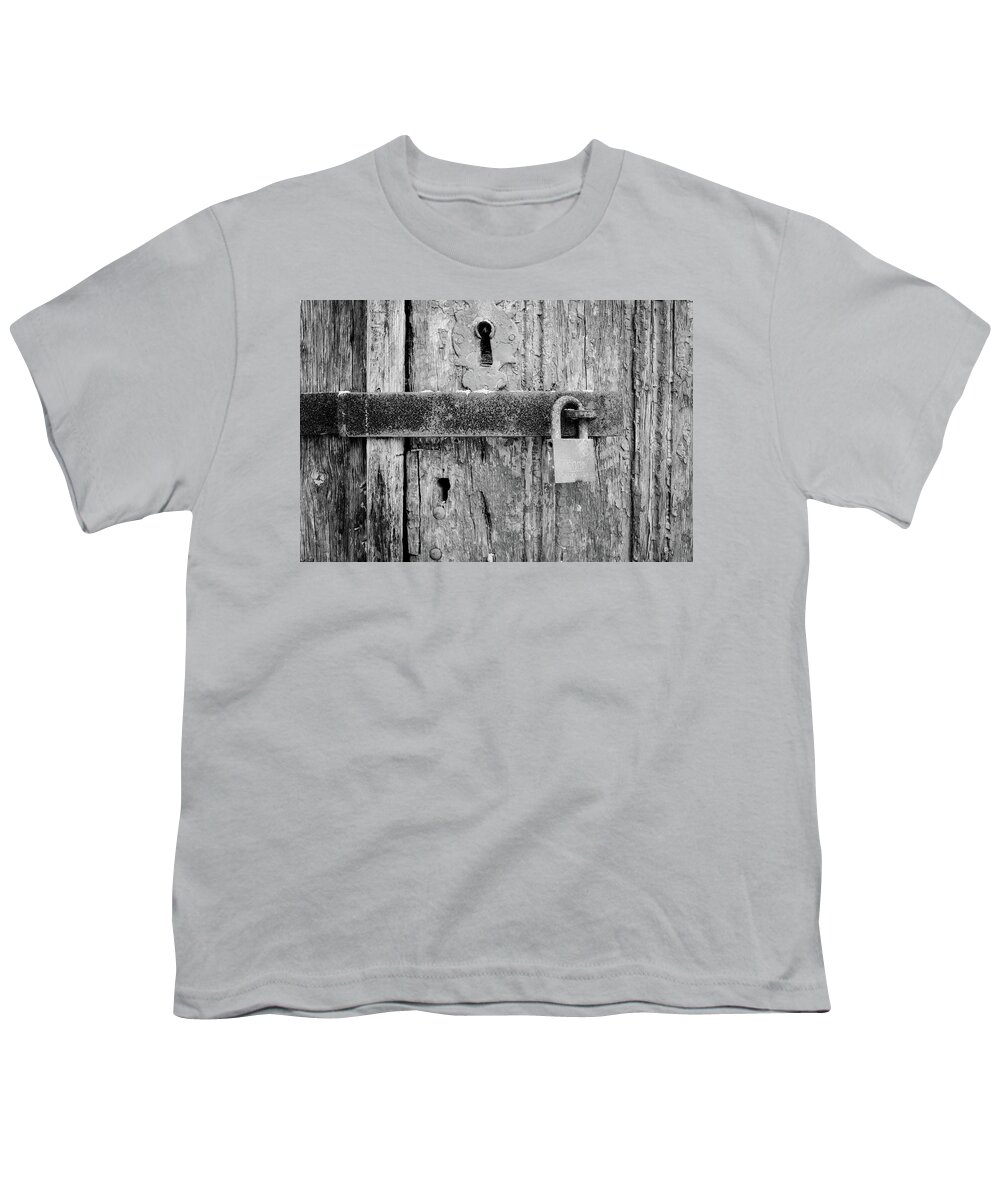 Padlock On An Old Wooden Door Youth T-Shirt featuring the photograph Padlock On An Old Wooden Door by Marco Oliveira
