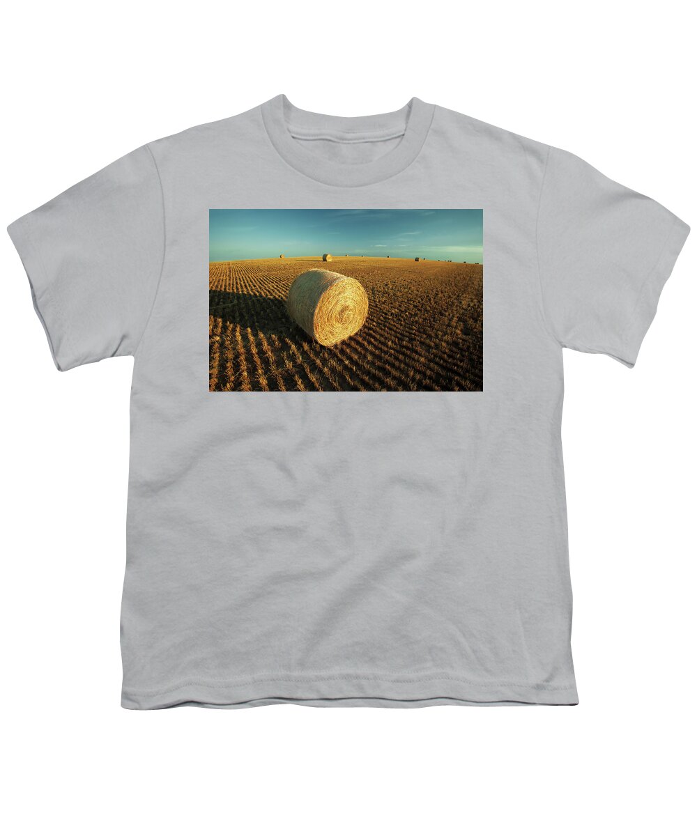 Montana Youth T-Shirt featuring the photograph Field Full of Bales by Todd Klassy