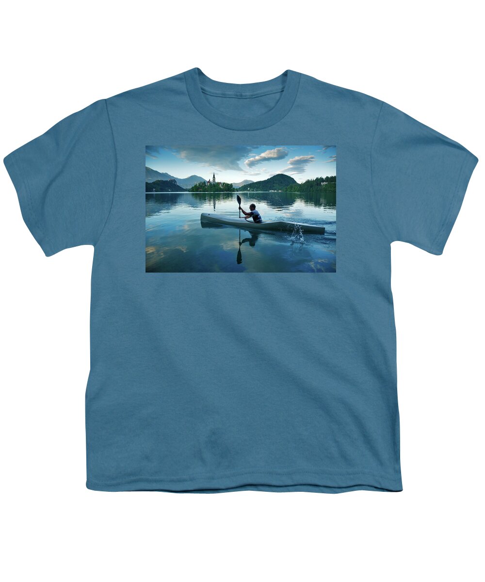 Bled Youth T-Shirt featuring the photograph Man canoeing on Lake Bled by Ian Middleton