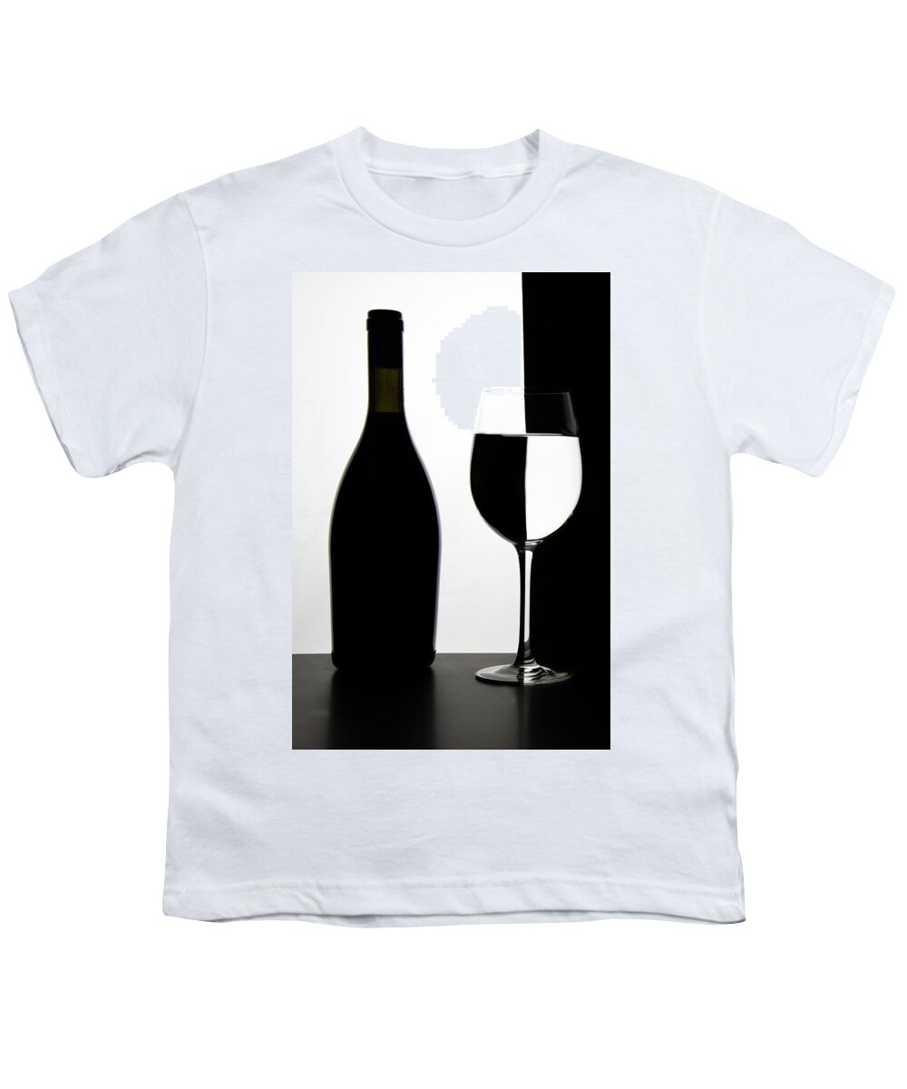 Wineglass Youth T-Shirt featuring the photograph Black bottle and empty glass of wine by Michalakis Ppalis