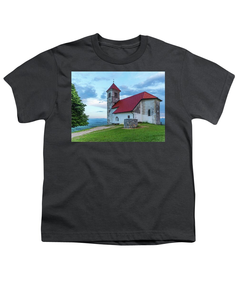 Europe Youth T-Shirt featuring the photograph A red roof church in Ljubjliana. by Usha Peddamatham