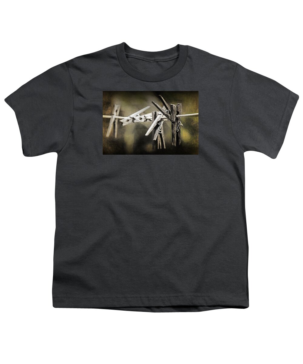 Clothespin Youth T-Shirt featuring the photograph Wooden Clothespins hanging on a Clothes Line by Randall Nyhof