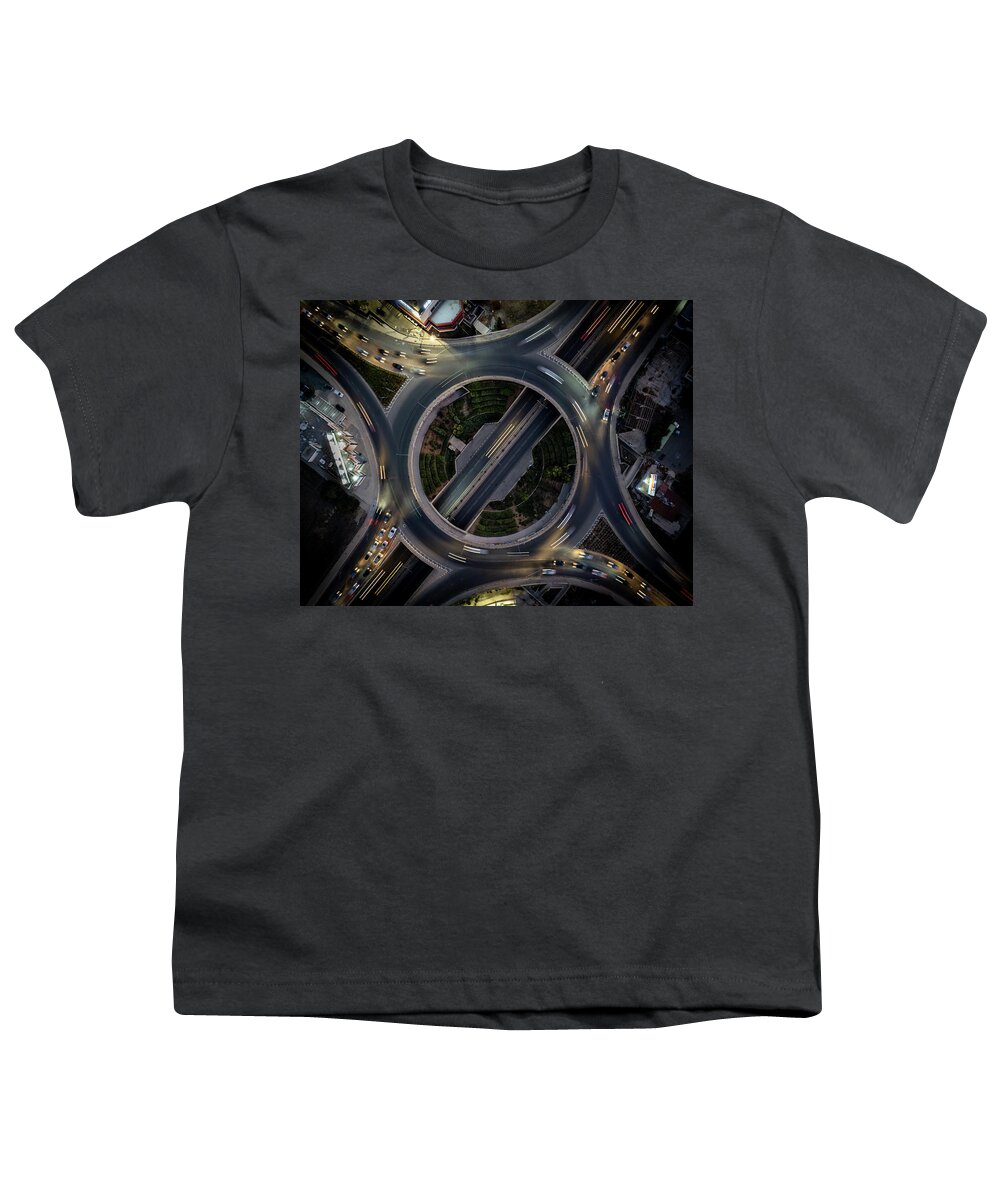 Speed Youth T-Shirt featuring the photograph Aerial drone top view of a modern motorway junction roundabout with cars moving. Transportation infrastructure, #1 by Michalakis Ppalis