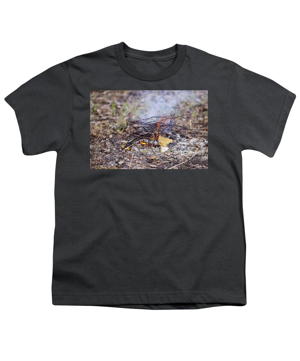 Bonfire Youth T-Shirt featuring the photograph Burning dry twigs. Bonfire at a camp in summer evening outdoors by Olga Strogonova