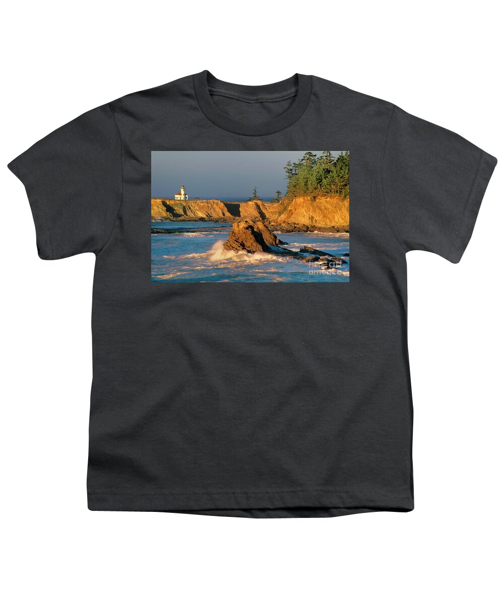 Dave Welling Youth T-Shirt featuring the photograph Cape Arago Lighthouse At Sunset Oregon by Dave Welling