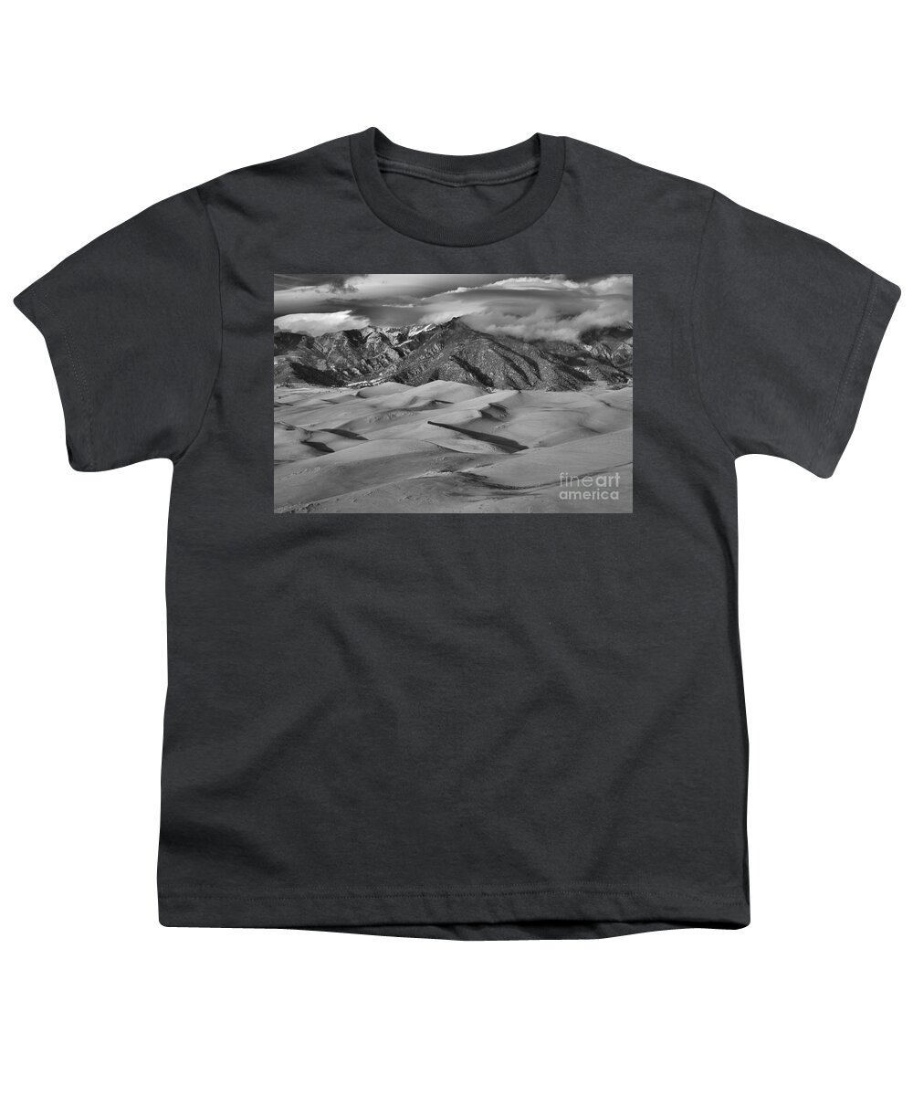Colorado Youth T-Shirt featuring the photograph Great Dunes And Shadows Below The Mountain Peaks Black And White by Adam Jewell