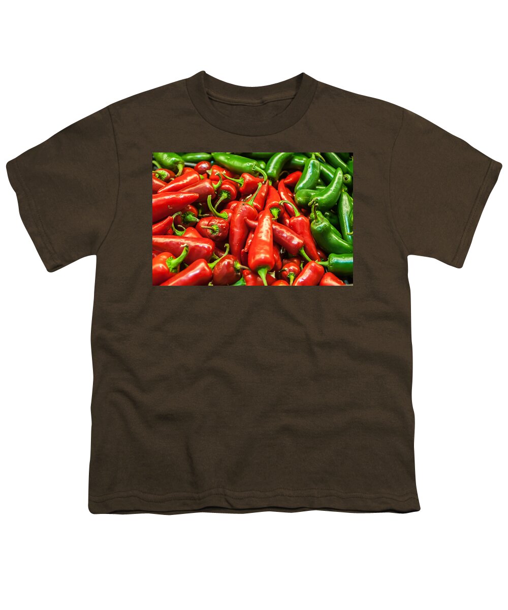 Bunch Youth T-Shirt featuring the photograph Delicious fresh green and red chili fruit on display at supermar by Alex Grichenko