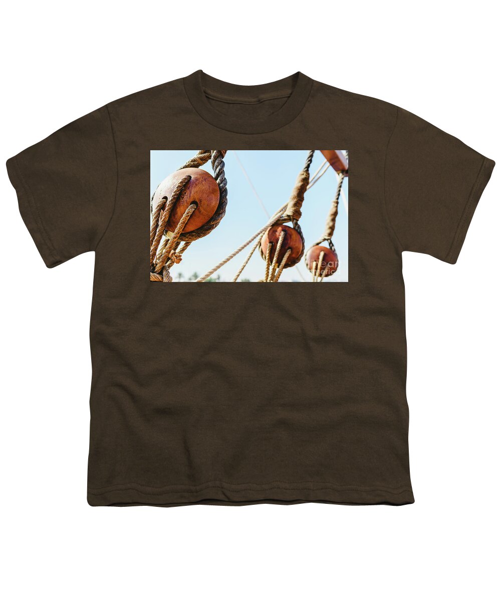 Adventure Youth T-Shirt featuring the photograph Rigging and ropes on an old sailing ship to sail in summer. #2 by Joaquin Corbalan