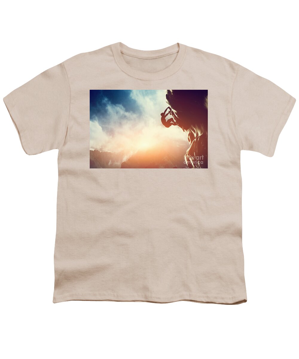 Climb Youth T-Shirt featuring the photograph A silhouette of man climbing on rock mountain by Michal Bednarek