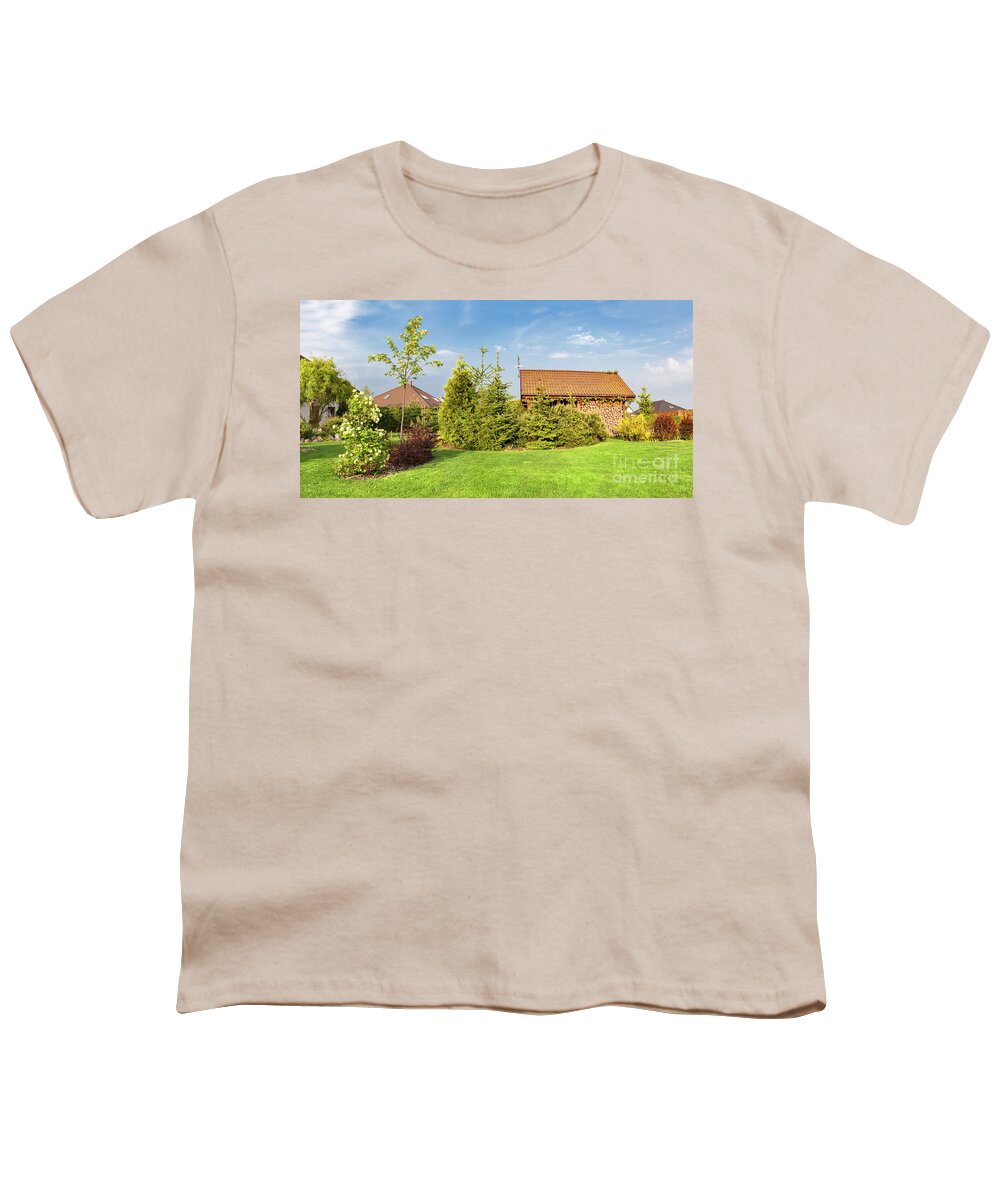 Garden Youth T-Shirt featuring the photograph Backyard of a family house. Landscaped garden with green mown grass, wood shelter. by Michal Bednarek