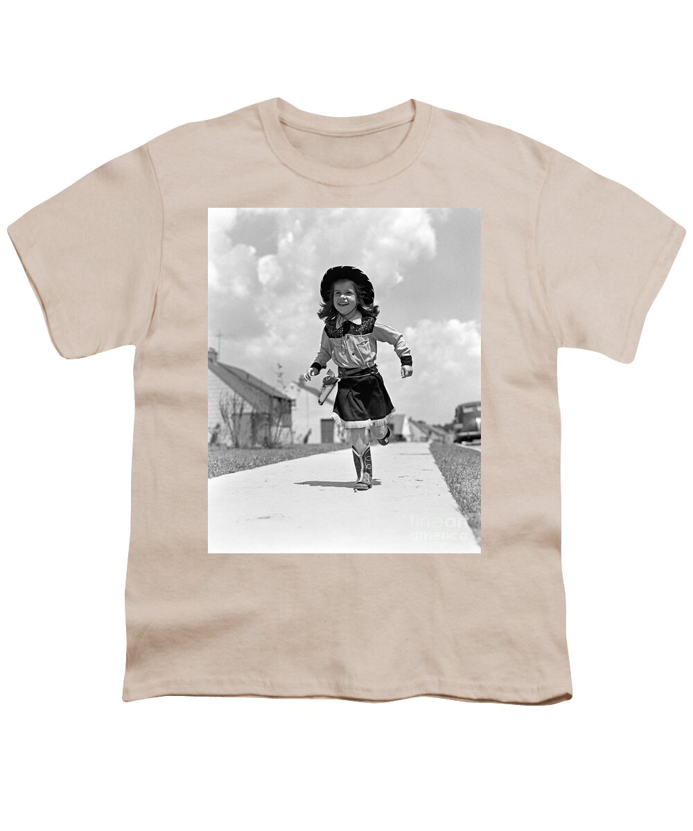 1950s Youth T-Shirt featuring the photograph Cowgirl Running Down Sidewalk, C.1950s by H. Armstrong Roberts/ClassicStock