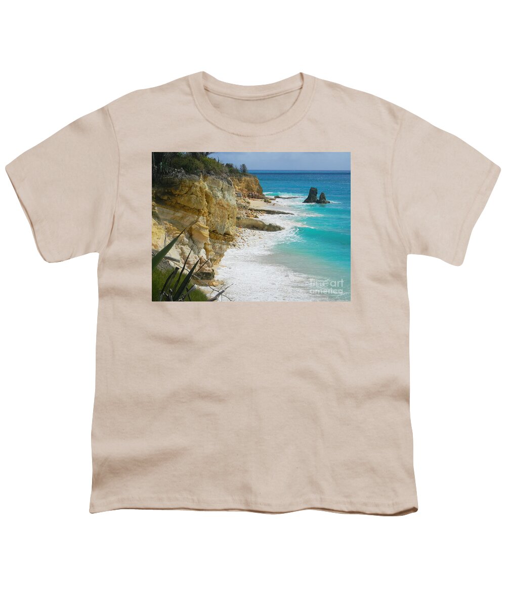 Seaside Rock Cliff Looms Above The Beach As A Turquoise Wave Washes The Unseen Sand And Is Replaced By Another . Youth T-Shirt featuring the photograph Cupecoy beach Wave 3 by Priscilla Batzell Expressionist Art Studio Gallery