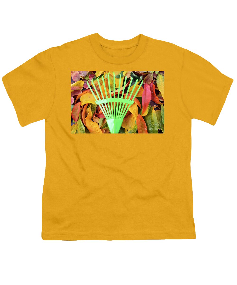 Autumn Youth T-Shirt featuring the photograph Autumn Fall Background with Green Rake. by Milleflore Images