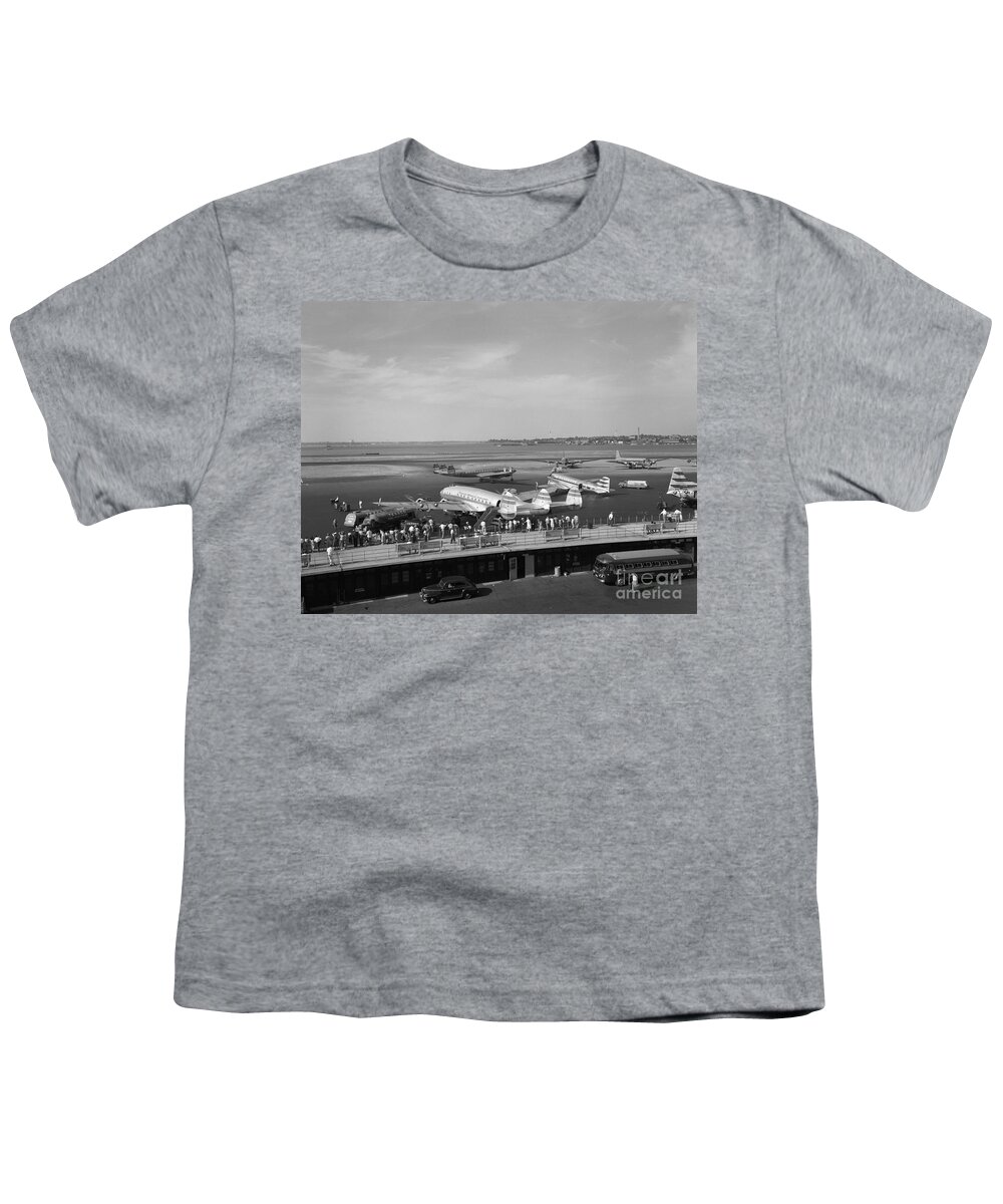 1950s Youth T-Shirt featuring the photograph Lockheed Constellation Plane Fueling Up by H. Armstrong Roberts/ClassicStock