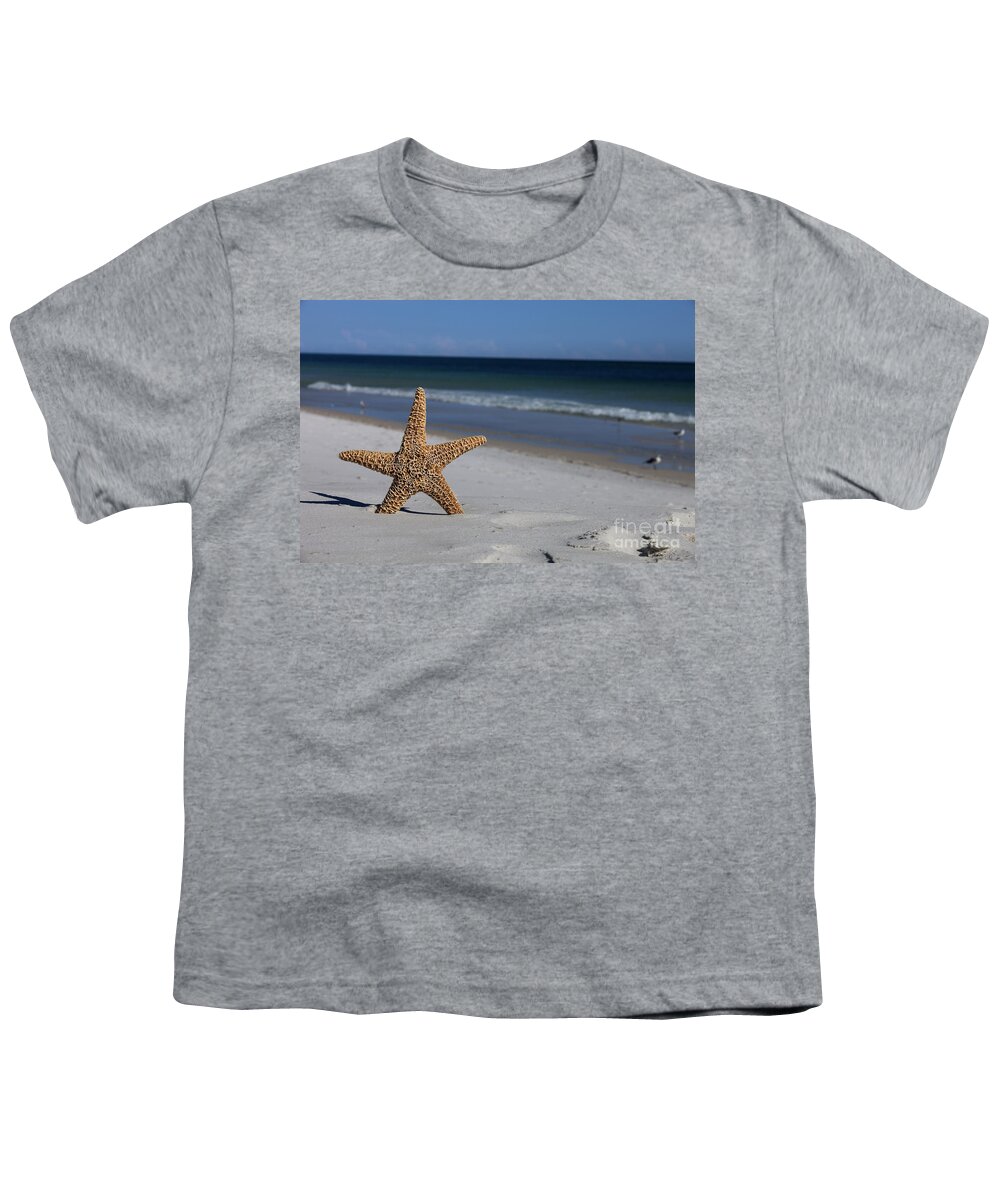 Starfish Youth T-Shirt featuring the photograph Starfish standing on the beach by Anthony Totah