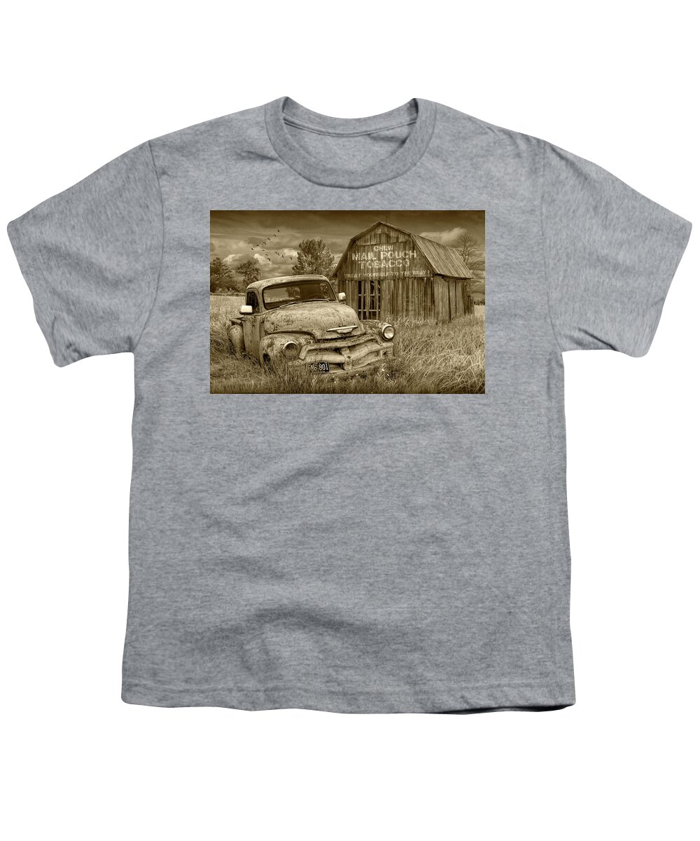 Chevy Youth T-Shirt featuring the photograph Sepia Tone of Rusted Chevy Pickup Truck in a Rural Landscape by a Mail Pouch Tobacco Barn by Randall Nyhof