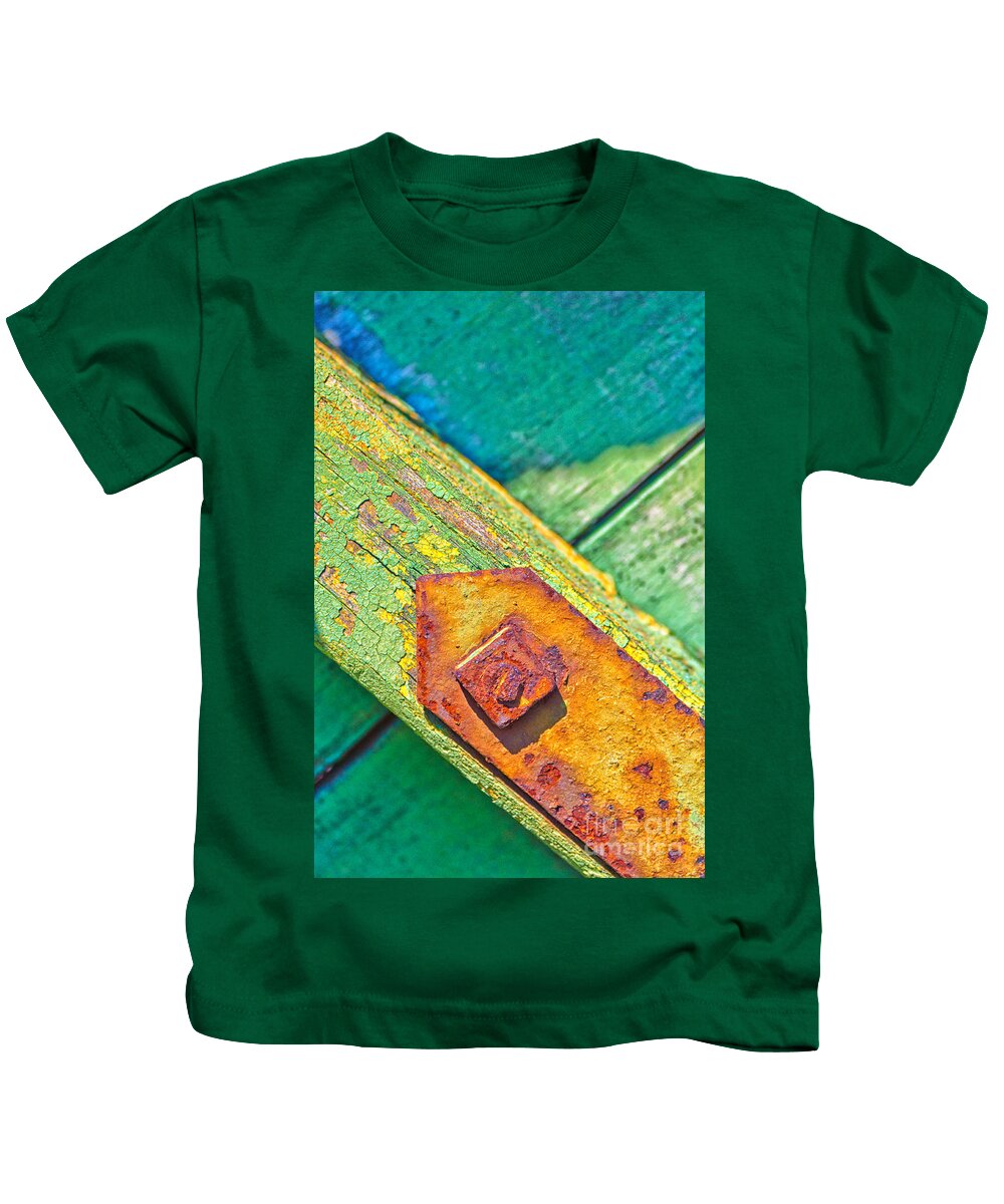 Abstract Kids T-Shirt featuring the photograph Rusty bolt on rotten green wood by Silvia Ganora