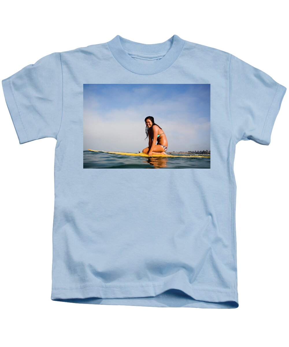 20-25 Years Kids T-Shirt featuring the photograph A Surfer Girl Smiles For The Camera by Jay Reilly