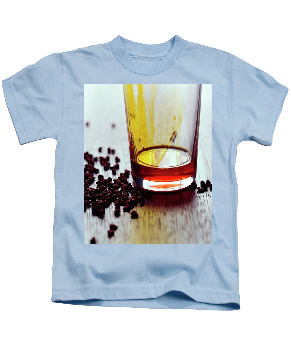 Cooking Kids T-Shirt featuring the photograph Annatto Seeds With A Glass by Romulo Yanes