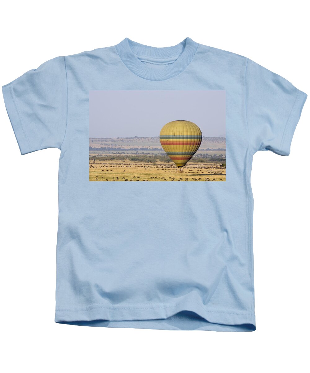 00761909 Kids T-Shirt featuring the photograph Hot Air Balloon Flying Over Wildebeest by Suzi Eszterhas