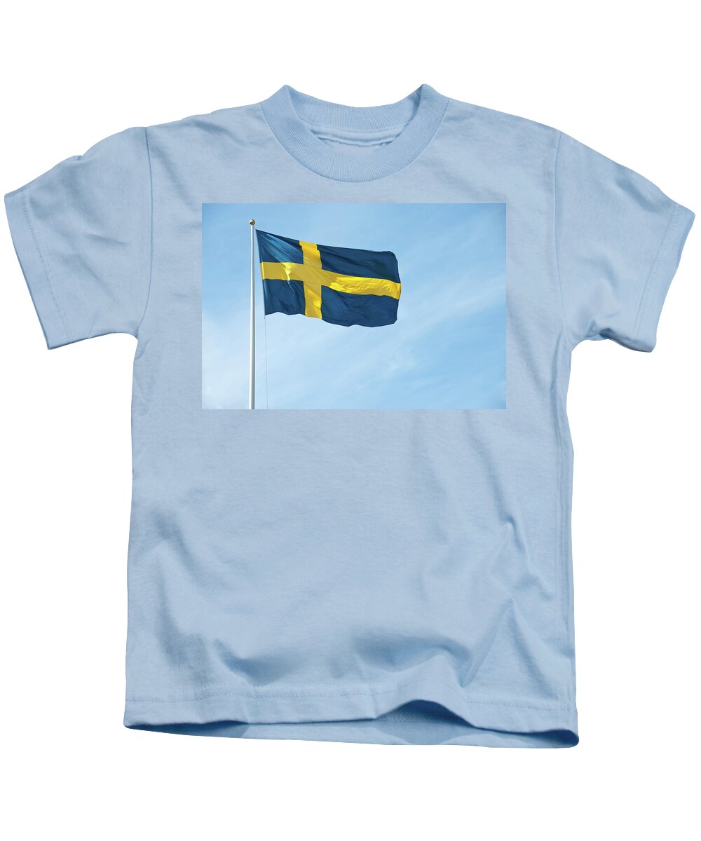 Sweden Kids T-Shirt featuring the photograph Flag of Sweden in the blue sky by GoodMood Art