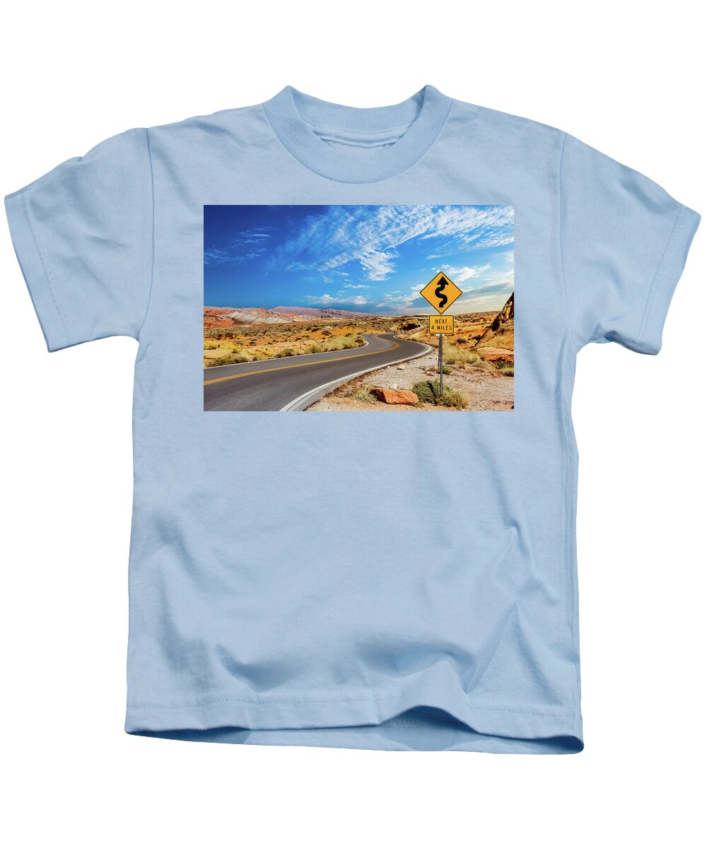 Vegas Kids T-Shirt featuring the photograph Road Sign for Curves in Desert by Darryl Brooks