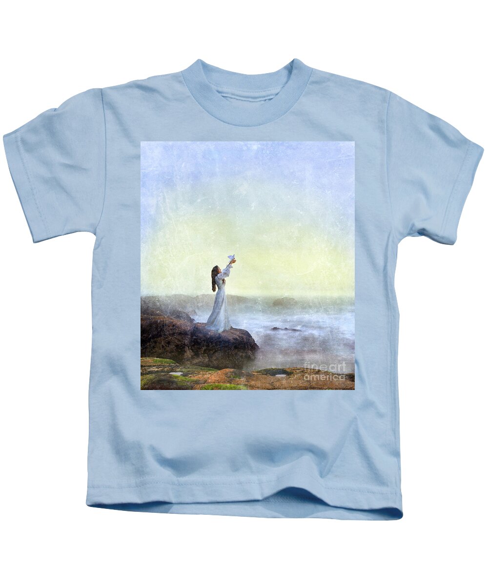 Woman Kids T-Shirt featuring the photograph Young Lady Releasing a Dove by the Sea by Jill Battaglia