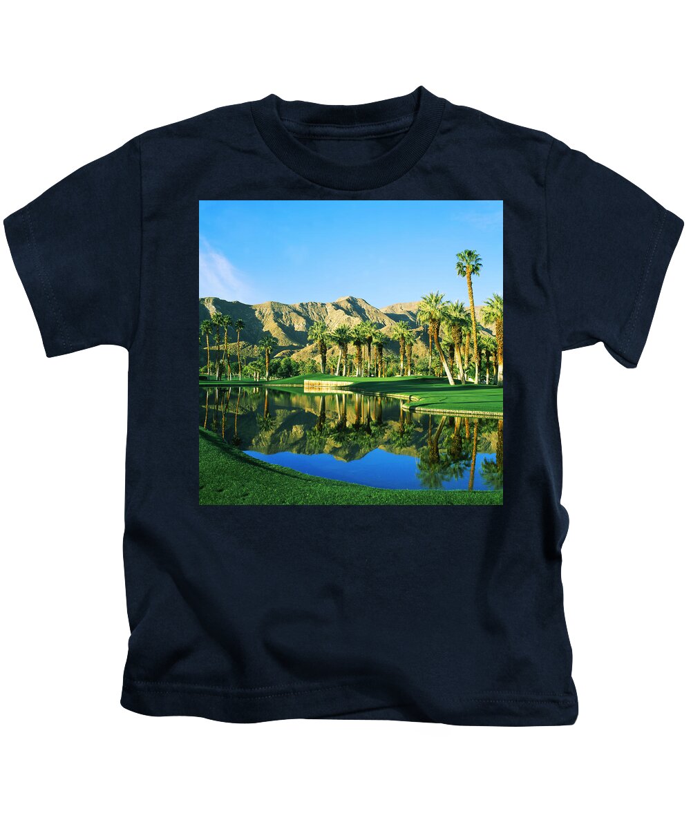 Photography Kids T-Shirt featuring the photograph Reflection Of Trees On Water In A Golf by Panoramic Images