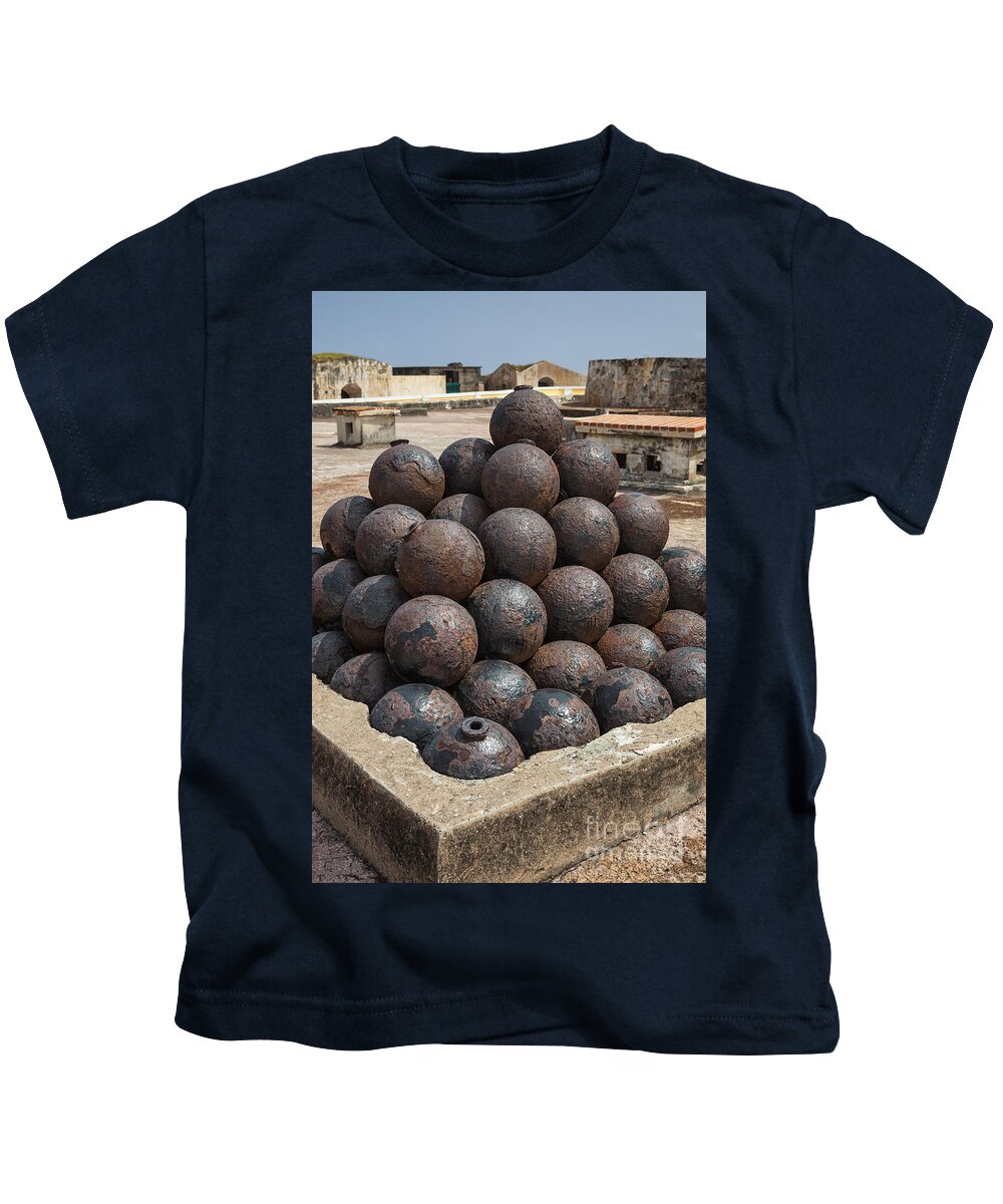 Artillery Kids T-Shirt featuring the photograph Stack Of Cannon Balls At Castillo San Felipe Del Morro by Bryan Mullennix