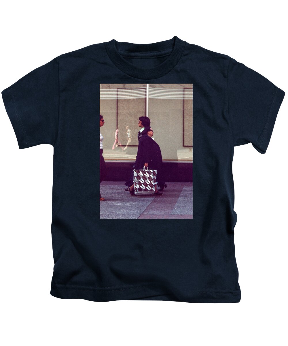 Actions Kids T-Shirt featuring the photograph Coming and going by Mike Evangelist