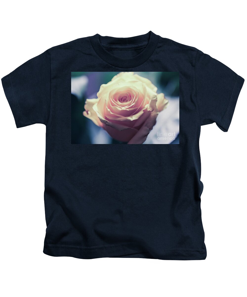 Art Kids T-Shirt featuring the photograph Light Pink Head Of A Rose On Blue Background by Amanda Mohler