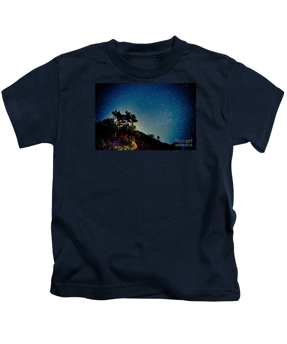 Tree Kids T-Shirt featuring the photograph Night sky scene with pine and stars by Raimond Klavins