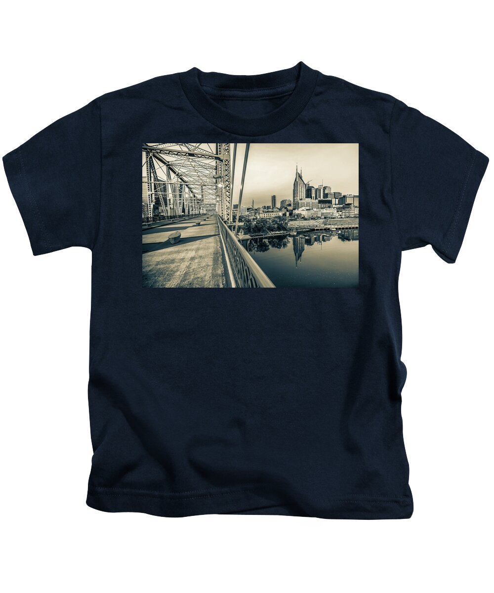 America Kids T-Shirt featuring the photograph Nashville Skyline - Shelby Street Bridge View in Sepia by Gregory Ballos