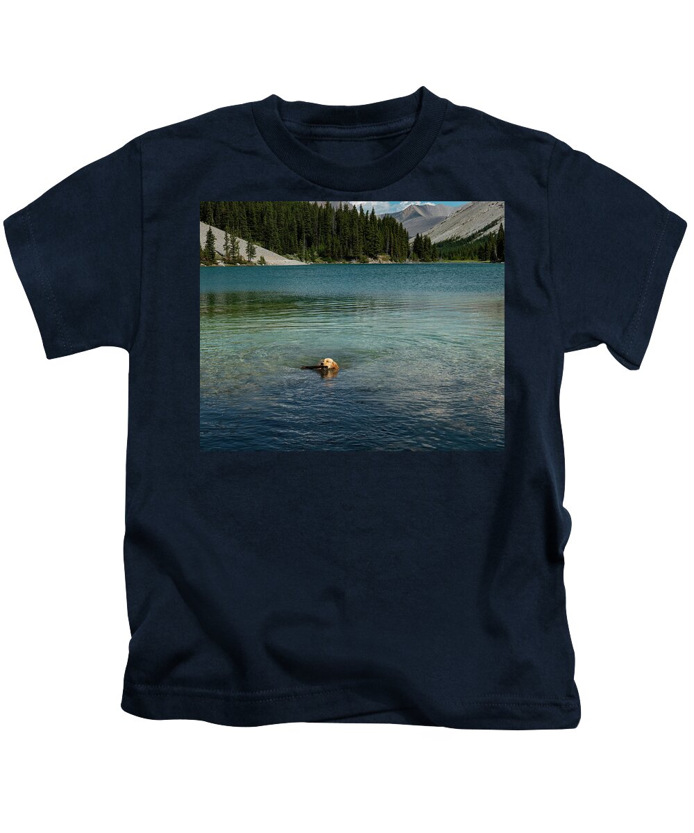 Dog Kids T-Shirt featuring the photograph Dog in Elbow Lake, Alberta by Karen Rispin