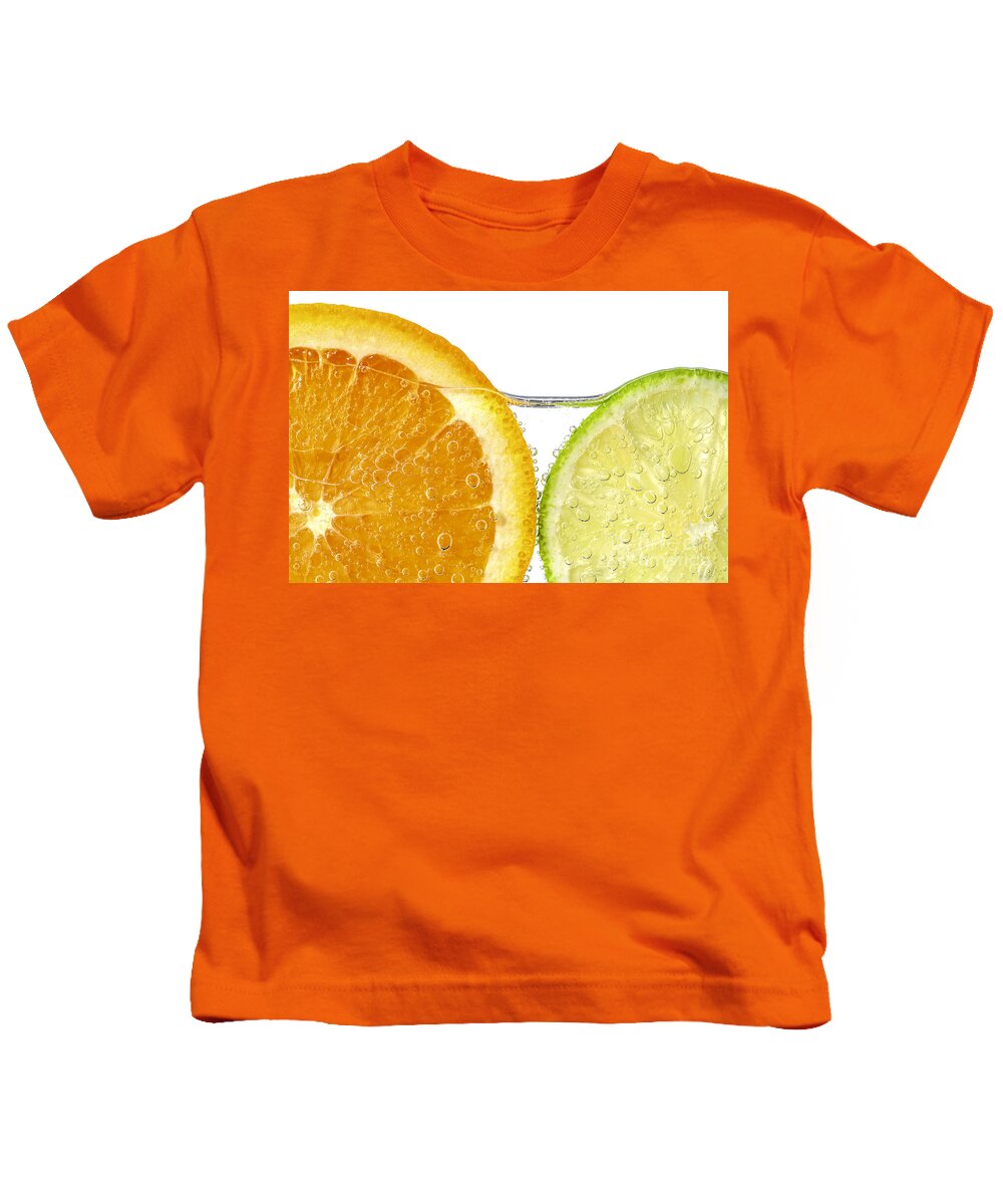 Orange Kids T-Shirt featuring the photograph Orange and lime slices in water by Elena Elisseeva