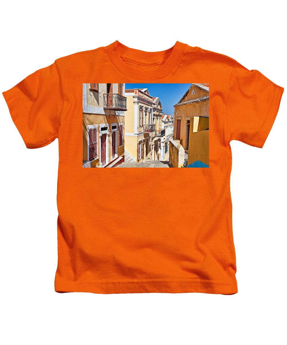 Upper Kids T-Shirt featuring the photograph The upper town of Symi island - Greece by Constantinos Iliopoulos