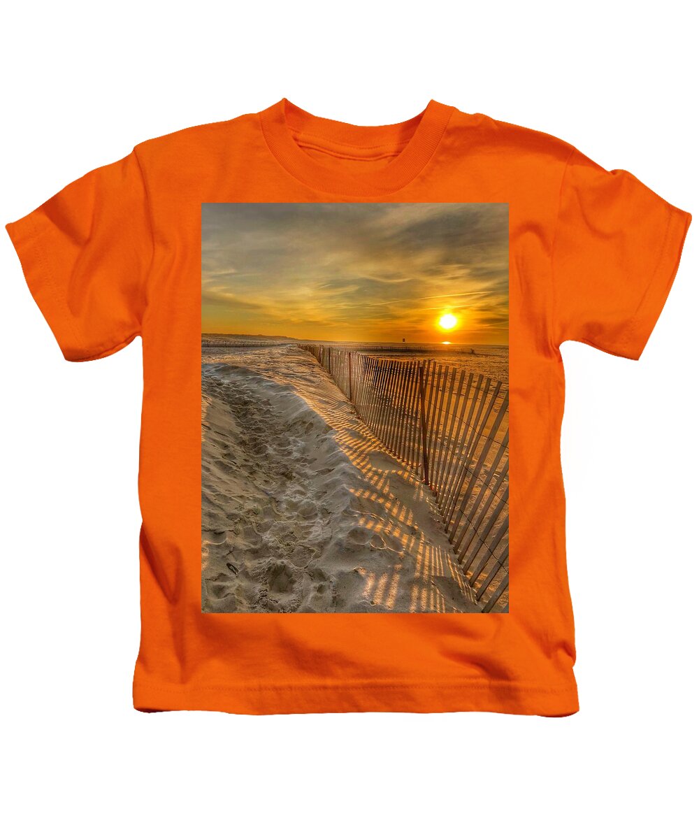This Is Photo Of A Storm Fence On Jones Beach At Sunrise Kids T-Shirt featuring the photograph Fence on the beach by Bill Rogers