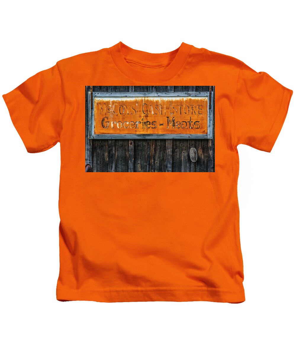 Old Store Sign Kids T-Shirt featuring the photograph McCoys Cash Store Sign by Ed Broberg