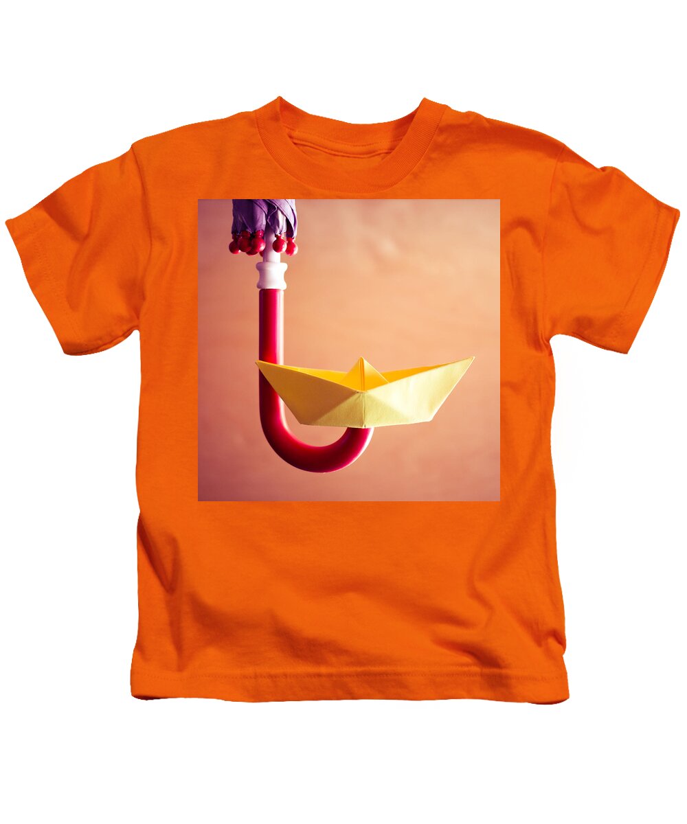 Paperboat Umbrella Handle Kids T-Shirt featuring the photograph Paper Boat Umbrella Handle by Janine Pauke