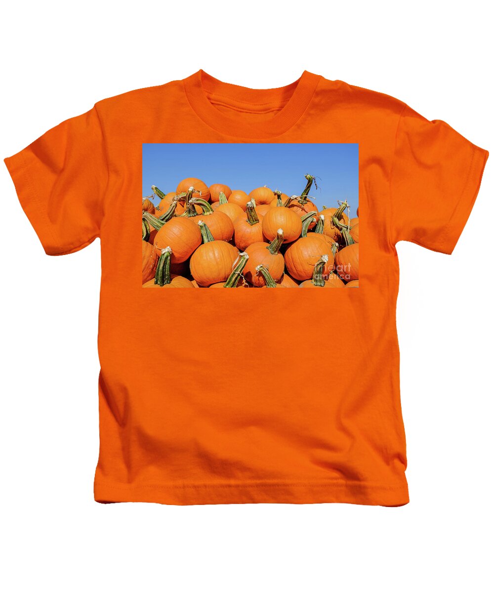 Pumpkin Kids T-Shirt featuring the photograph Pile of pumpkins by Iryna Liveoak