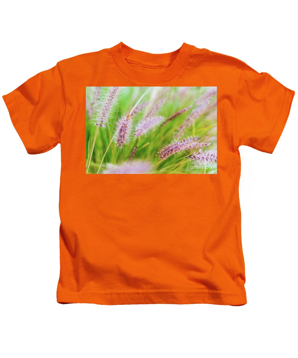 Aroma Kids T-Shirt featuring the photograph Colorful flowers in purple spikes, purple fountain grass, close- by Joaquin Corbalan