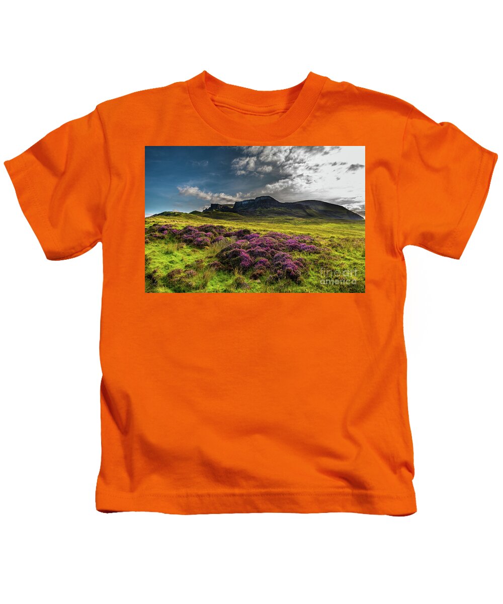 Abandoned Kids T-Shirt featuring the photograph Pasture With Blooming Heather In Scenic Mountain Landscape At The Old Man Of Storr Formation On The by Andreas Berthold