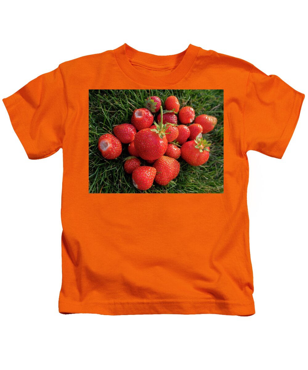 Strawberries Kids T-Shirt featuring the photograph Fresh Strawberries In The Grass by Karen Rispin