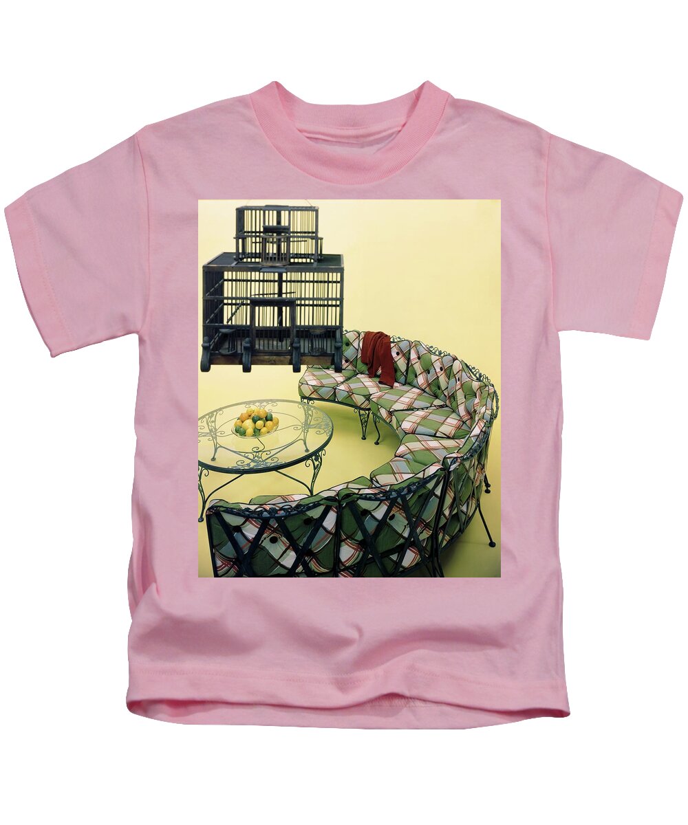 Copy Space Kids T-Shirt featuring the photograph A Round Couch And A Birdcage by Haanel Cassidy